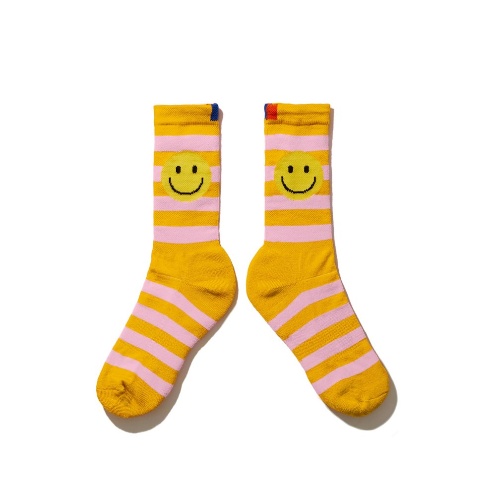 https://kule-shop.imgix.net/s/files/1/1067/4288/products/KULE_Rugby_Smile_Sock_Gold_Pink_Resized.jpg?w=1000&q=80&auto=format